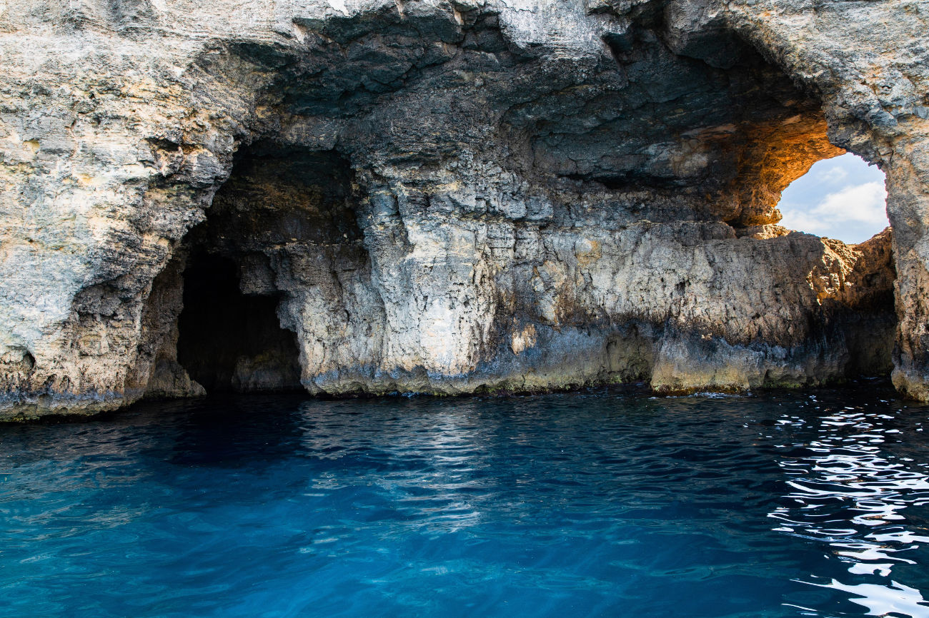 Comino Caves: Natural Wonders and Coastline Beauty