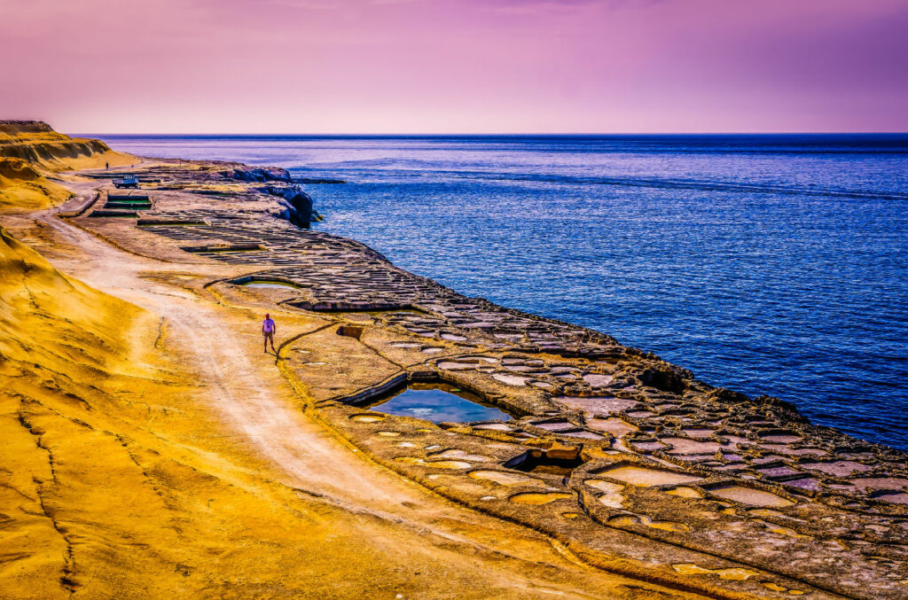 The Xwejni salt pans at sunset in Gozo.
