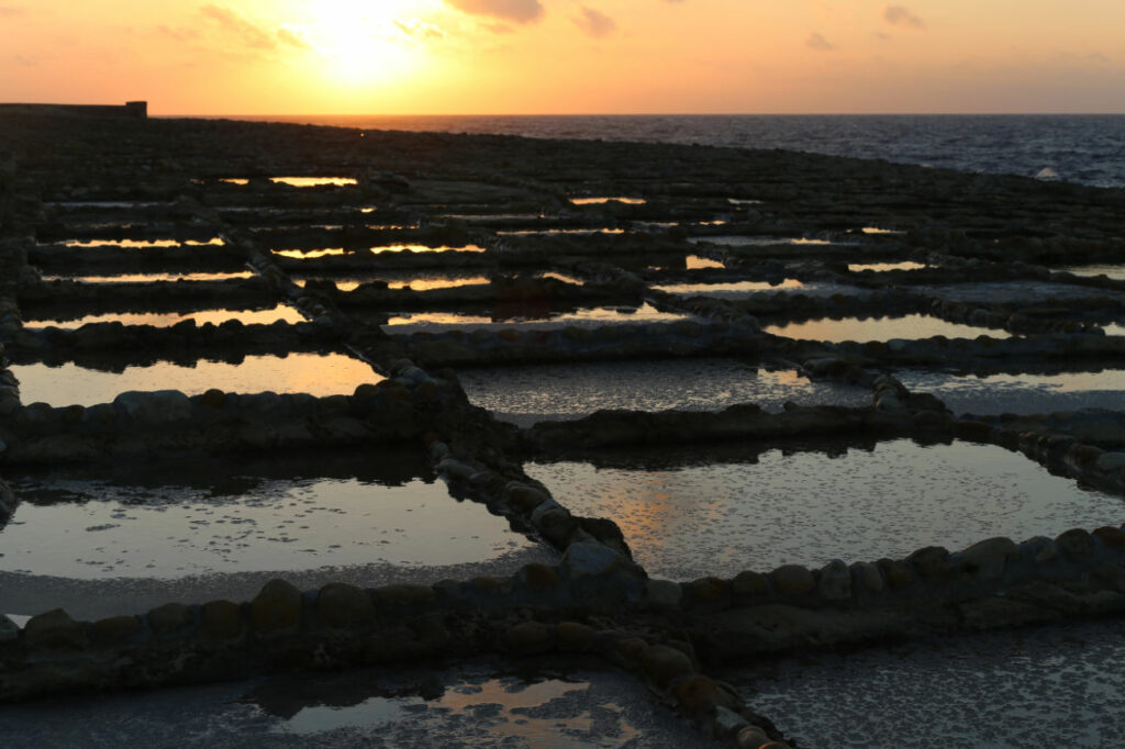 The salt pans in Gozo at sunset.